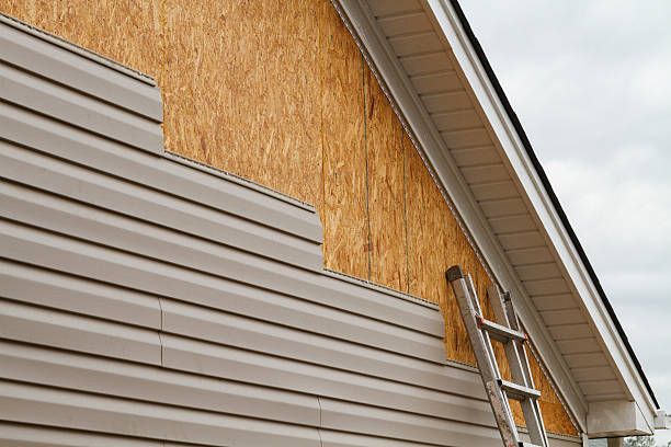 Professional Storm Damage Siding Repair technician working in Grantville, GA